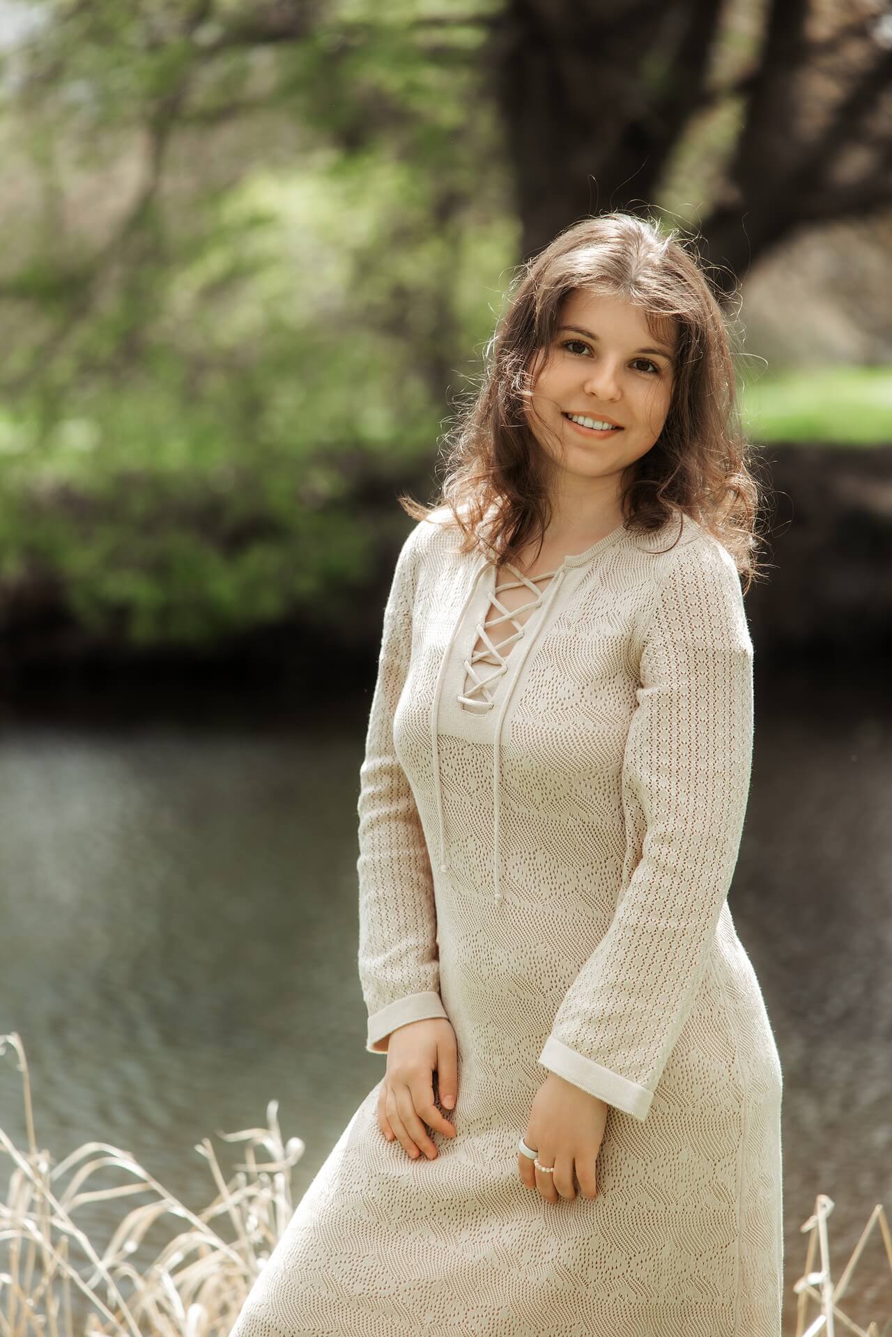Anna beside a woodland stream